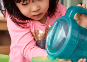 Child pouring cup