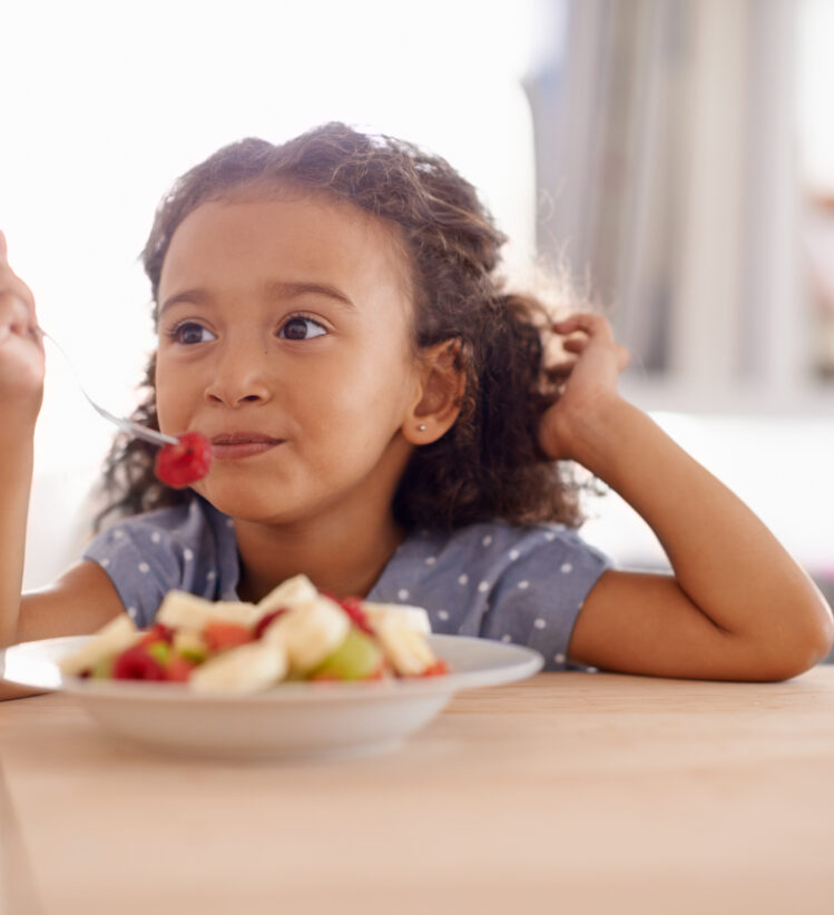 girl eating fruit