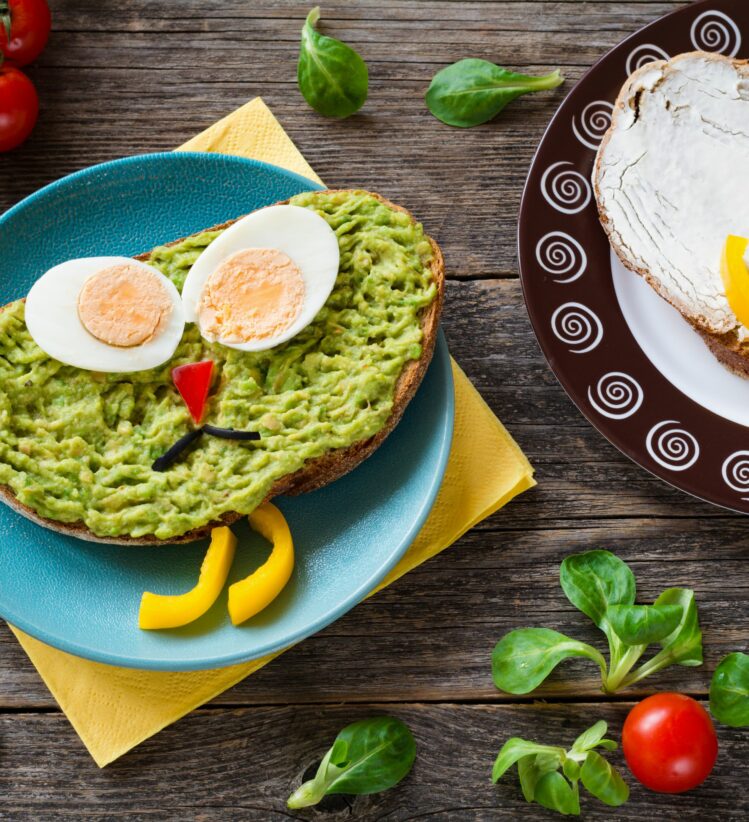 Kids plate with toast decorated with food to show a face