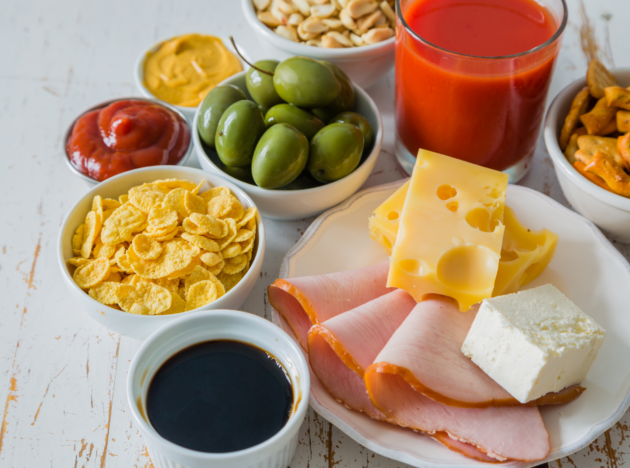 A spread of olives, cheese, meats and chips