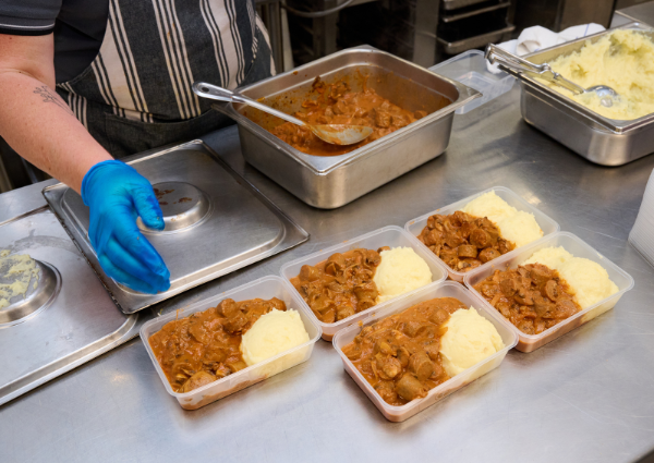 Meat and mashed potato being served