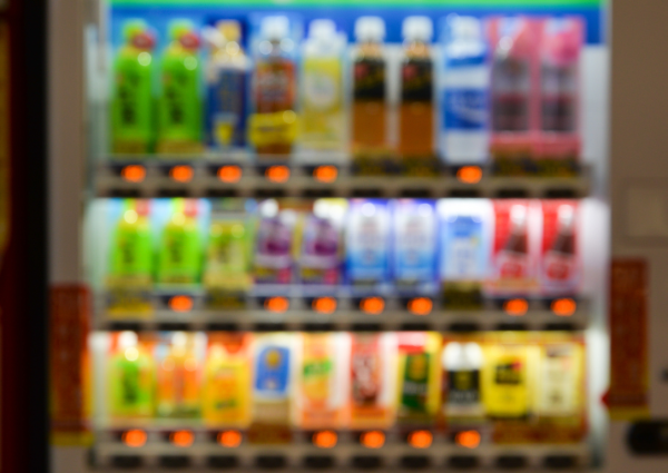 Blurred vending machine with sugary drinks