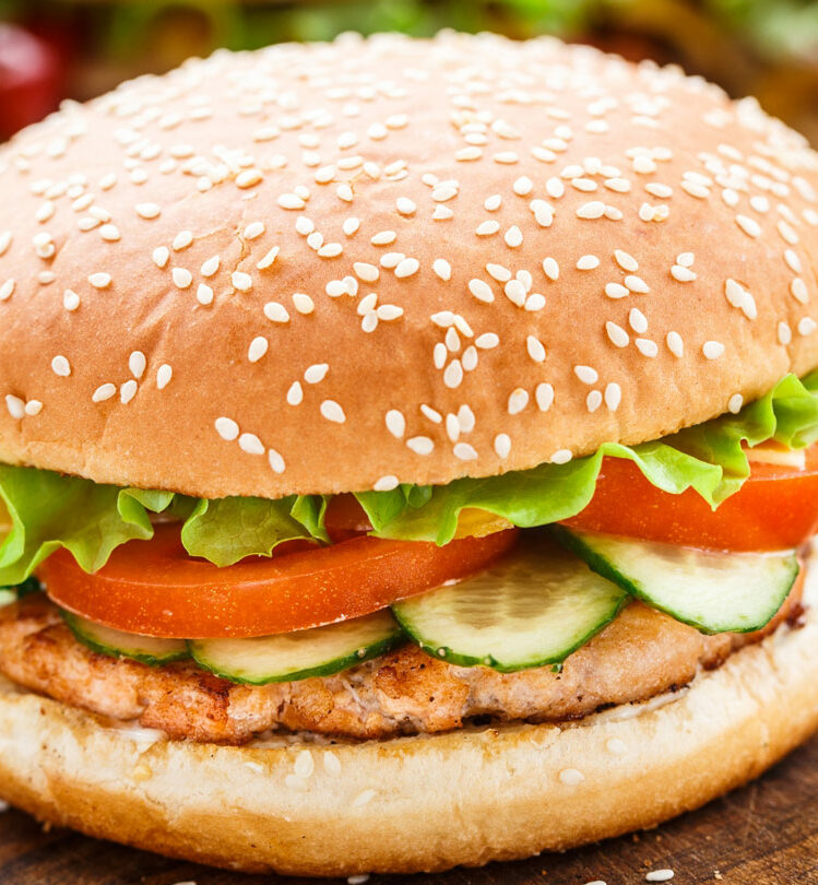 burger served on wooden board