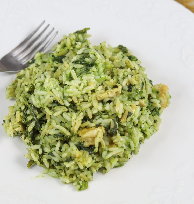 Serve of baked chicken risotto with fork