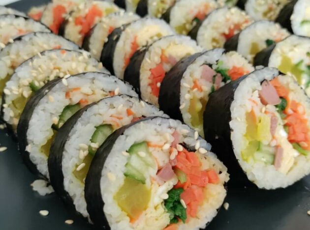 a board with a selection of kimbap