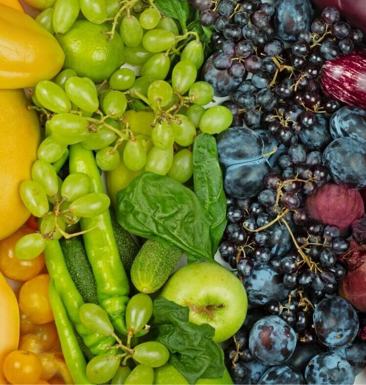 an arrangement of fruit in a rainbow order
