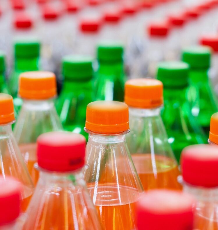 Lots of bottles of different soft drinks