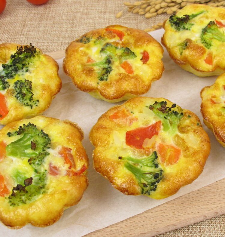 Six mini vegetable frittatas on a board
