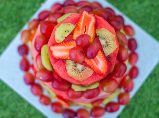 a watermelon fruit cake on a plate