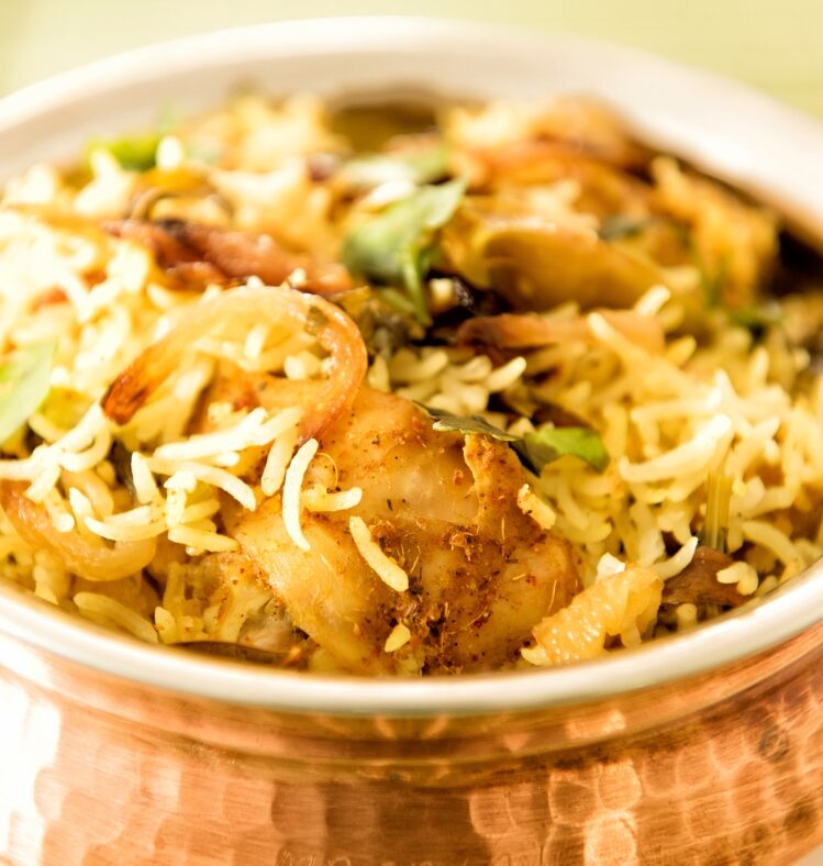 a serving of chicken biriyani in a bowl