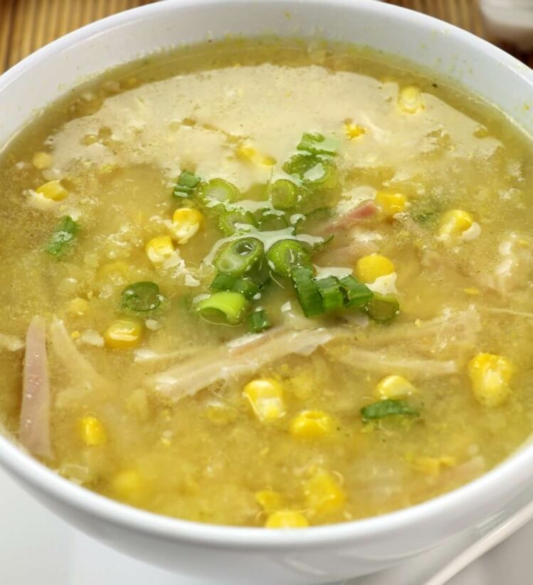 A bowl of chicken, potato and sweet corn soup