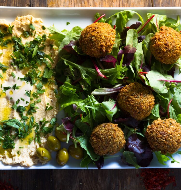 Hummus served with falafel and tomato salad