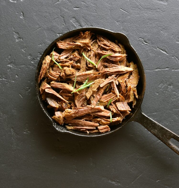 Saucepan filled with pulled beef