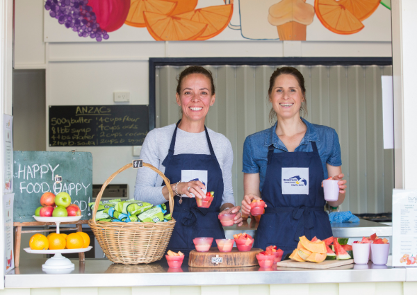 People selling fruit samples