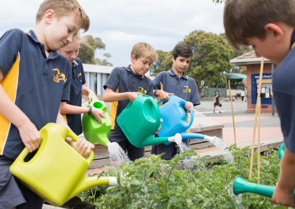 Children watering garden