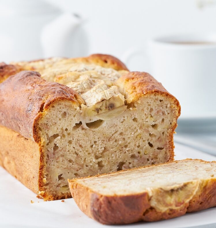 Loaf of banana bread with a slice cut off the end