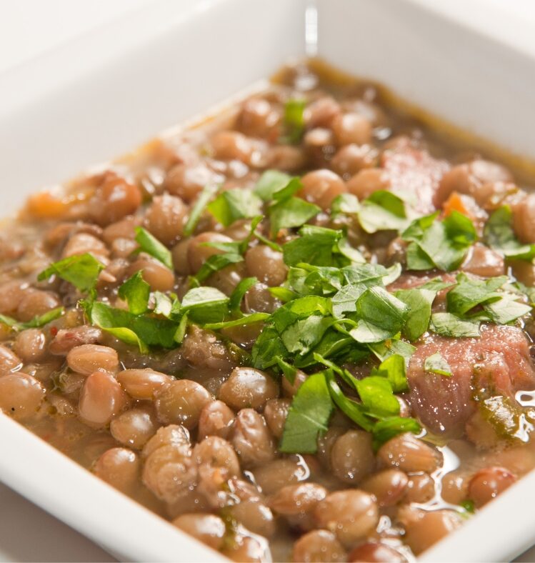 Persian pork and lentil stew in a white bowl