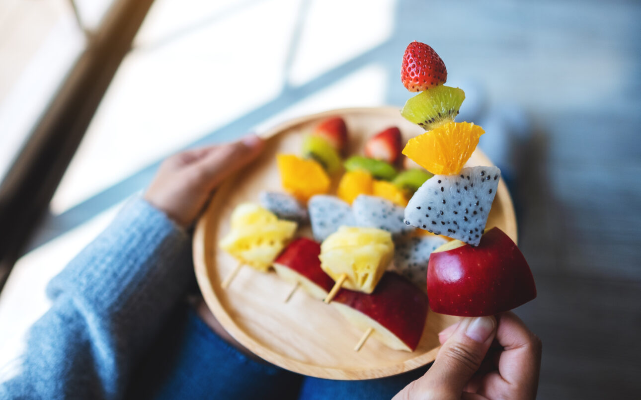 person holding fruit