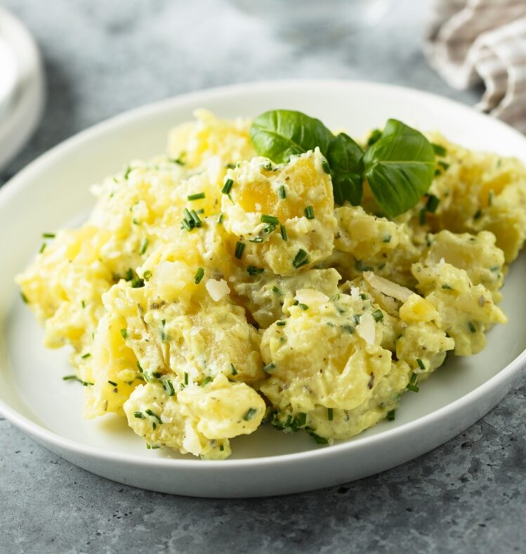Potato salad with chives and roast onion in a bowl