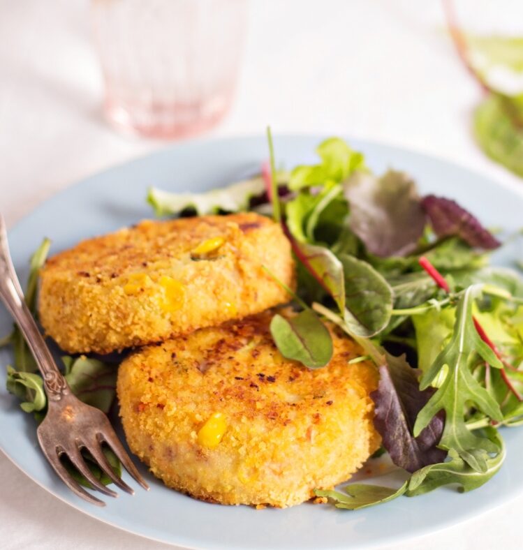 tuna and corn patties served with a side of mixed leaf salad