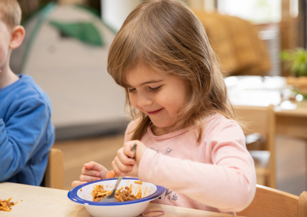 Child eating pasta