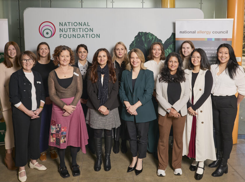 The National Allergy Council team and the Healthy Eating Advisory Service team posing in front of banners