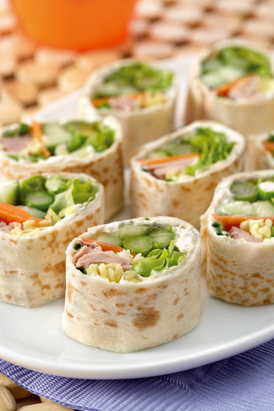 Small wraps with ham, cheese and veggies