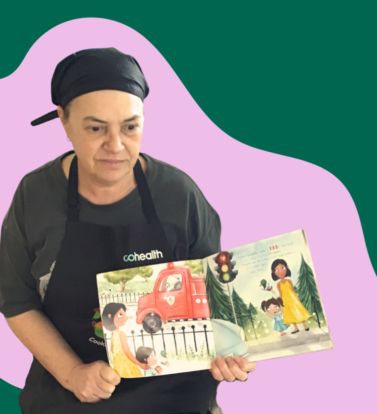 Early childhood chef reading a book to children